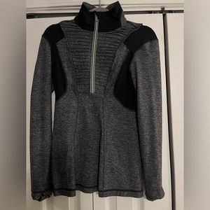 Lululemon half zip pullover with zipper pocket on the back.
